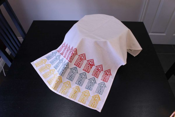 Block printed beach hut tea towel