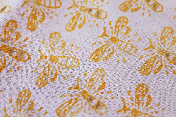 Block printed bee tote bag closeup