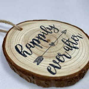 Decorative stamped wood-round, "Happily ever after"