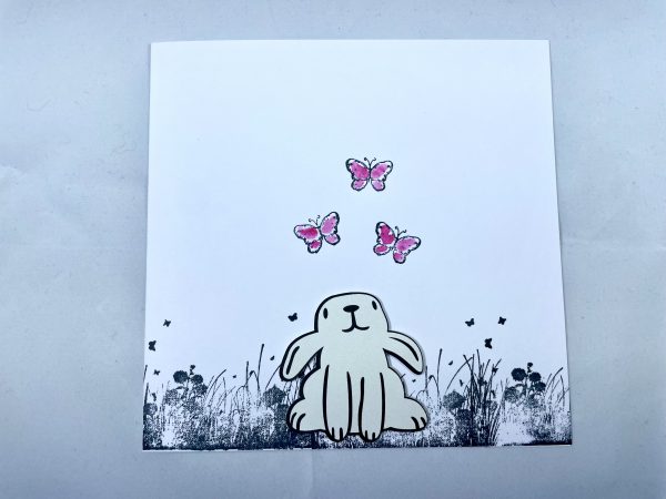 Little bunny with pink butterflies